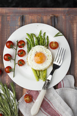 green asparagus with fried eggs