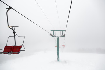 Fototapeta na wymiar Ski-lift in fog