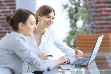 members of the business team working on laptop.