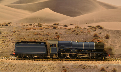 A model of a Kings class locomotive set on a scenic background
