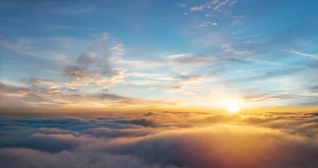 Poster Mooie luchtfoto boven wolken met zonsondergang © Jag_cz