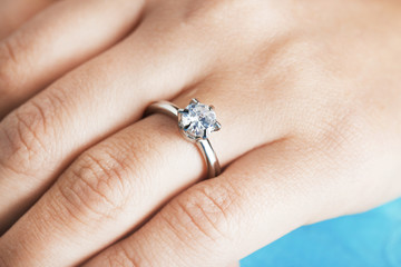 Woman's hand with luxury engagement ring, closeup