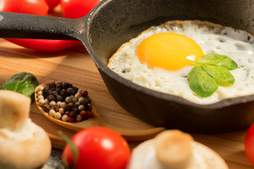 Fried eggs in a frying pan. Rustic breakfast