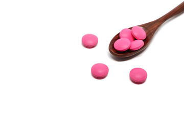 Top view of pink ibuprofen pills on white background for healthcare and medical concept