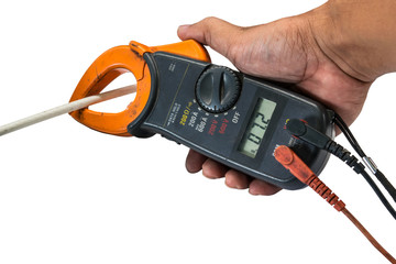 Digital clamp multimeter in man's hand on a white background