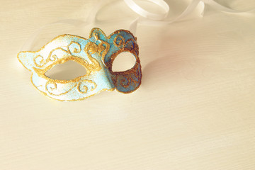 Image of delicate blue elegant venetian mask white background.