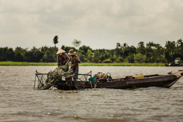 Fishermen on the Mekong river