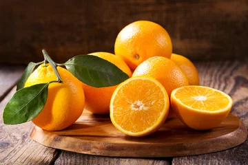 Photo sur Aluminium Fruits fruits oranges frais avec des feuilles