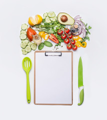 Healthy lifestyle and clean eating concept.  Various fresh salad vegetables with cooking spoon and...