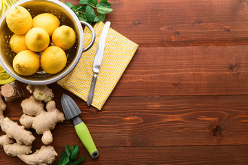 lemon and ginger with mint and honey. on a wooden background in a rustic style.