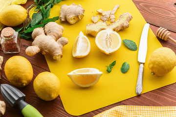 lemon and ginger with mint and honey. on a wooden background in a rustic style.