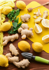 lemon and ginger with mint and honey. on a wooden background in a rustic style.