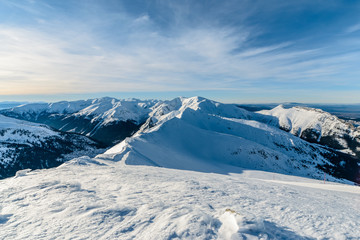 Fototapeta na wymiar The snow-capped high Tatras near Kasprowy Wierch morning foto.