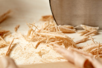 DIY concept. Woodworking and crafts. Chisel. plane and stock on the workbench. Top view. Wooden background.