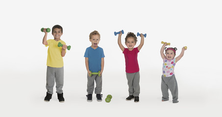 Three little kids lifting weights and one silly boy, isolated on white background