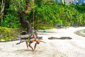 Beautiful woman is relaxing on Papaya beach in El Nido bay, Philippines