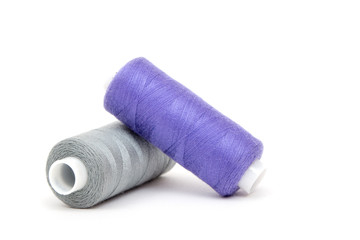 Set of colorful spools of thread isolated