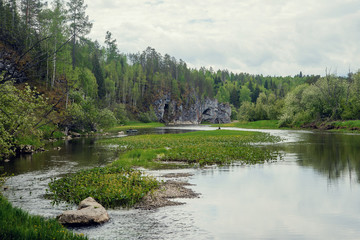 The blue ribbon of the river from the height of the mountains. Wild nature, taiga. Tourism. Far East, Sakhalin Island, Russia.