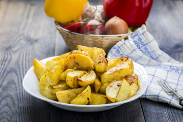 Plate with roasted potatoes