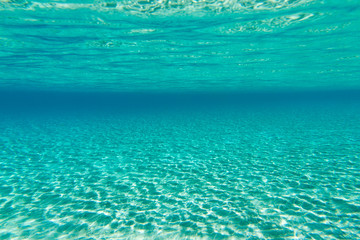 Fototapeta na wymiar Underwater shoot of an infinite sandy sea