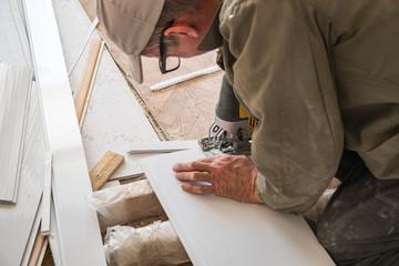 Builder works with white plastic parts