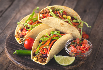 Mexican tacos with beef, vegetables and spices - obrazy, fototapety, plakaty