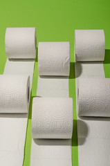 Toilet paper concept on green background. Hygiene and health. Concept photo.