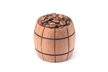 Roasted coffee beans in a wood barrel
