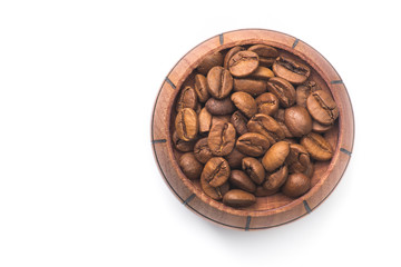 Roasted coffee beans in a wood barrel