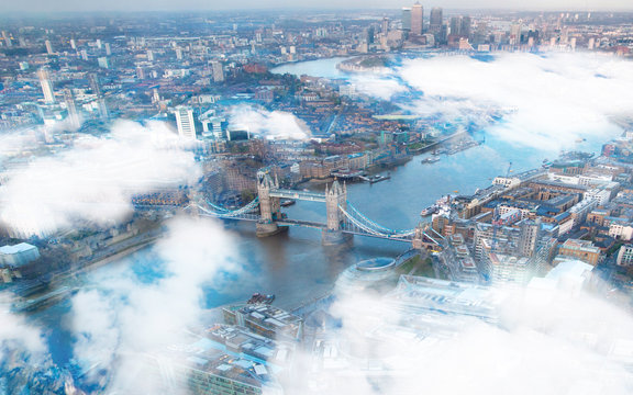 Tower bridge and City of London through the clouds.