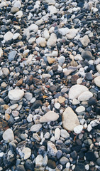 Sea pebble colorful wet background, vintage hipster image