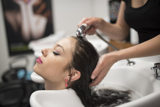 Washing hair in hair dressing saloon
