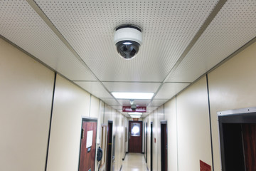 CCTV system security camera or cctv camera on ceiling in apartment room or living quarter