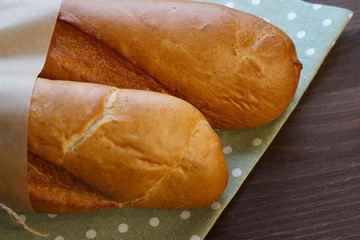 French baguette on the kitchen table. Close-up. Selective focus.