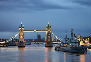 Fototapeta na wymiar London cityscape with illuminated Tower Bridge and HMS Belfast