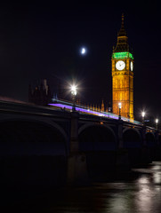 London night scene with illuminated Westminster Bridge and Elizabeth Tower or Big Ben