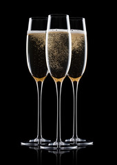 Elegant glasses of yellow champagne with bubbles