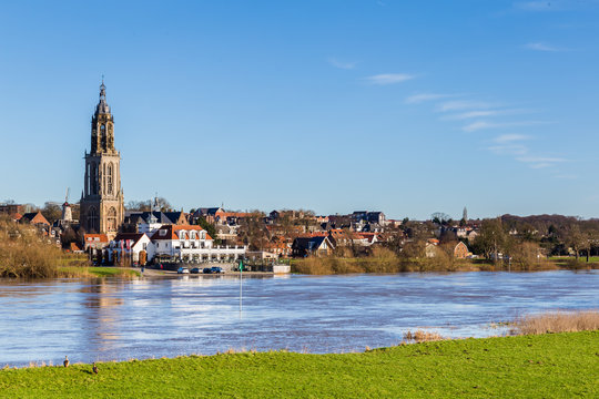 Landscape with a view on the flooded river Rhine and the small town  Rhenen in the Netherlands
