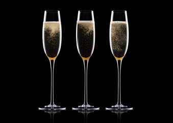Elegant glasses of yellow champagne with bubbles