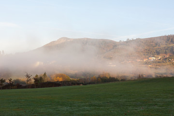 Fototapeta premium Morning fog in the Park of the Way of Saint James (Parque del Camino de Santiago) in Oviedo, Asturias, Spain