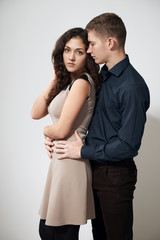 romantic couple posing on white background, love concept