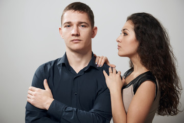 romantic couple posing on white background, love concept