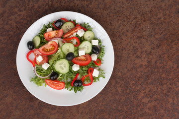 Traditional greek sallad on white plate