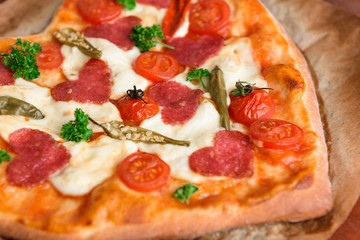 pizza heart for the Valentine's Day holiday. classic Italian pizza with salami and mozzarella