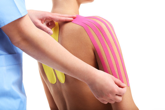 Picture showing special physio tape put on injured back over white background