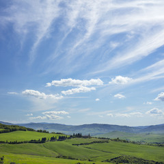 Fototapeta na wymiar sky and clouds above tuscany valley in Italy