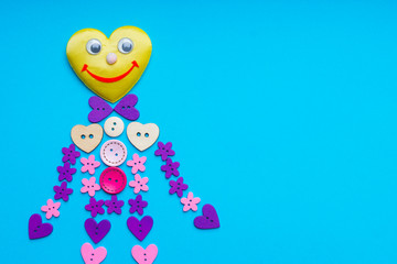 People shape made from round, flower and star shaped buttons 