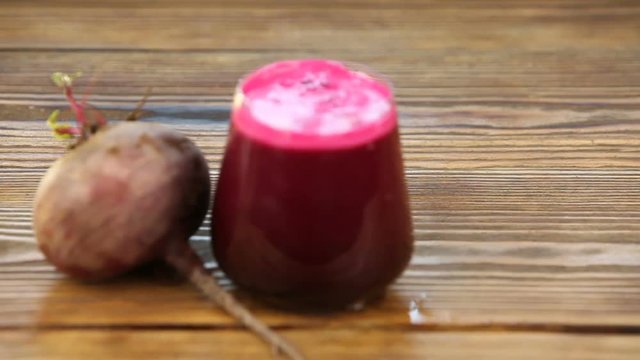 beet juice in glass on  table