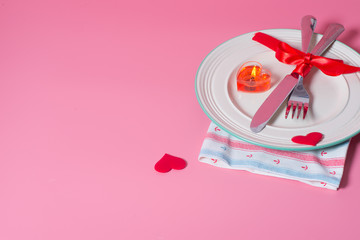 Valentines day table setting with plate On pink background