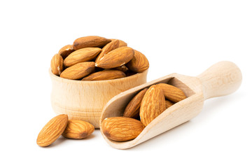 Almonds in a wooden bowl and spoon closeup.